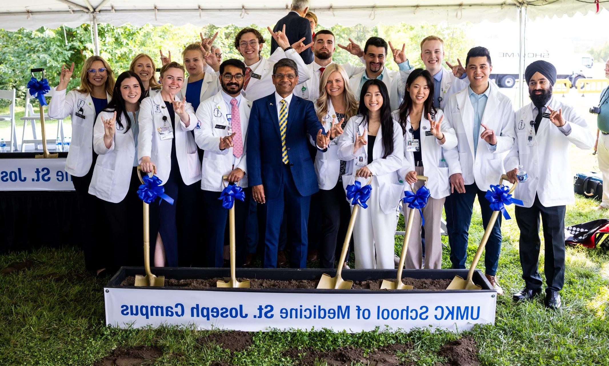 Chancellor Agrawal and approximately 15 medical students participate in a groundbreaking ceremony